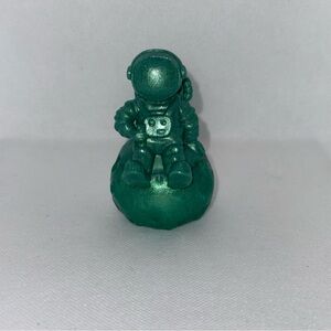 Whimsical Green Art Sculpture with Stylized Features